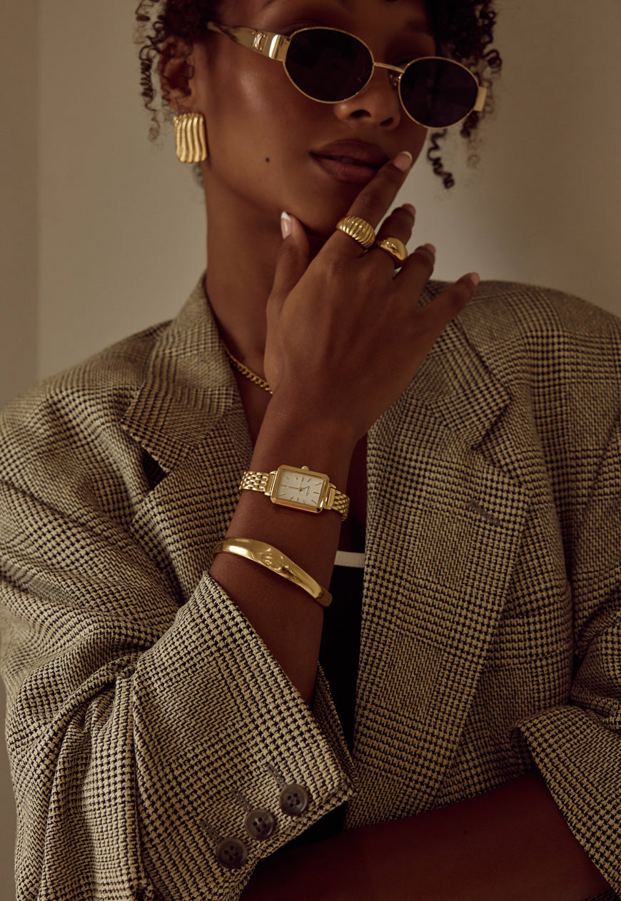 Cendré Demi gold bangle worn on the wrist