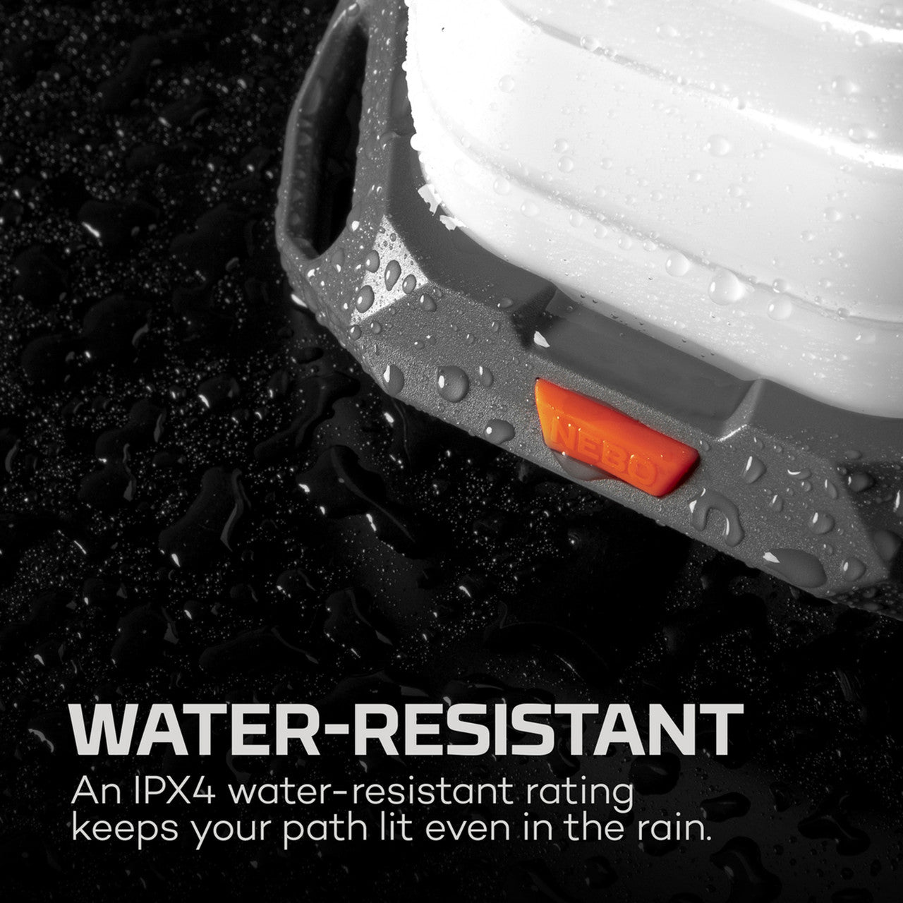 Water-resistant headlamp with visible orange light and water droplets on its surface.