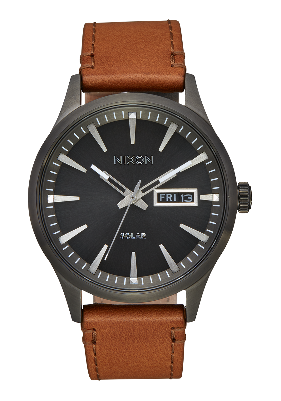 Wristwatch with a black face, brown leather strap, and gunmetal gray case.