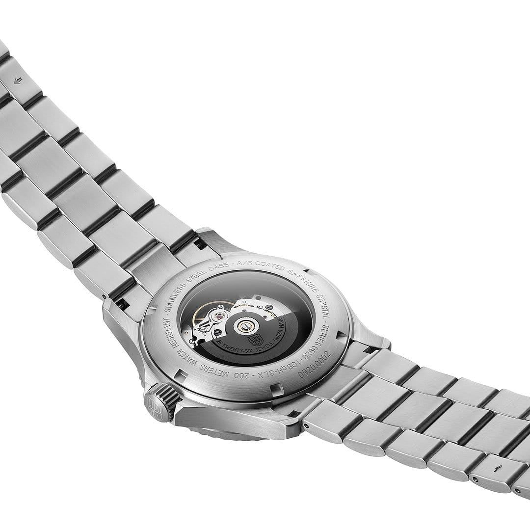 Stainless steel wristwatch with visible mechanical movement through the transparent case back.