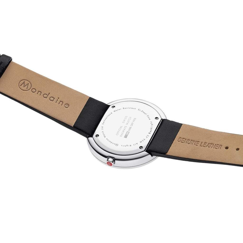Wristwatch with a silver round face and black leather strap.