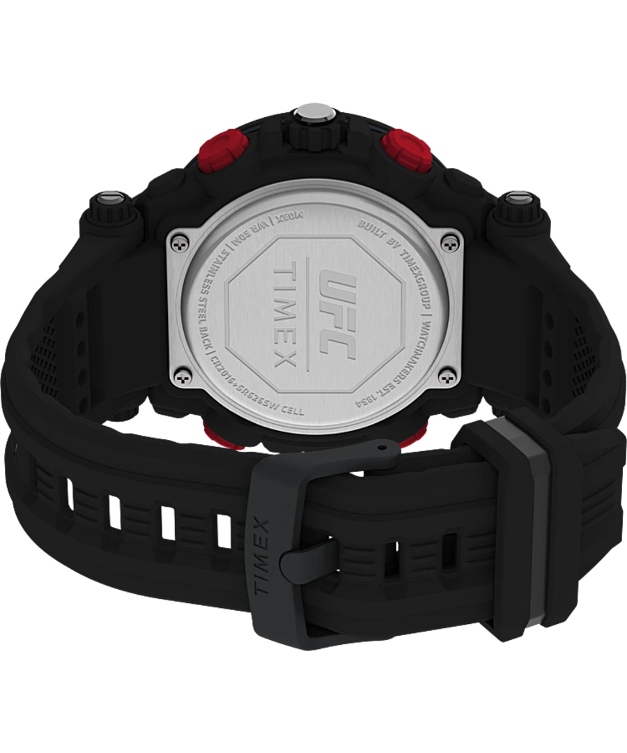 Back of a black and red sports watch with a visible metal case back.