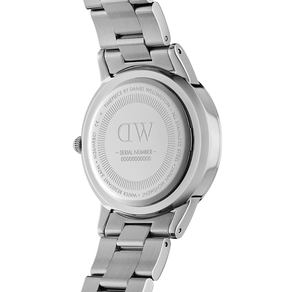 Stainless steel wristwatch with a metal bracelet band, showing its caseback.