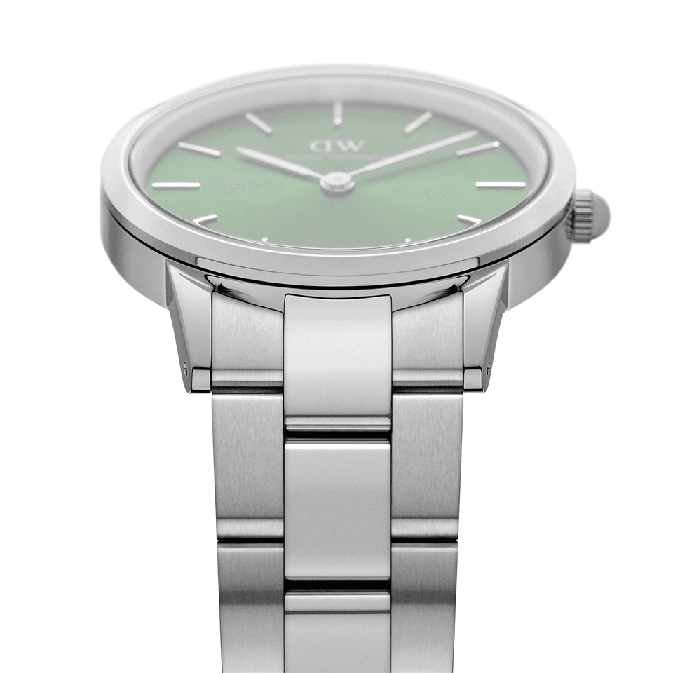 Stainless steel wristwatch with a round face and mint green dial.
