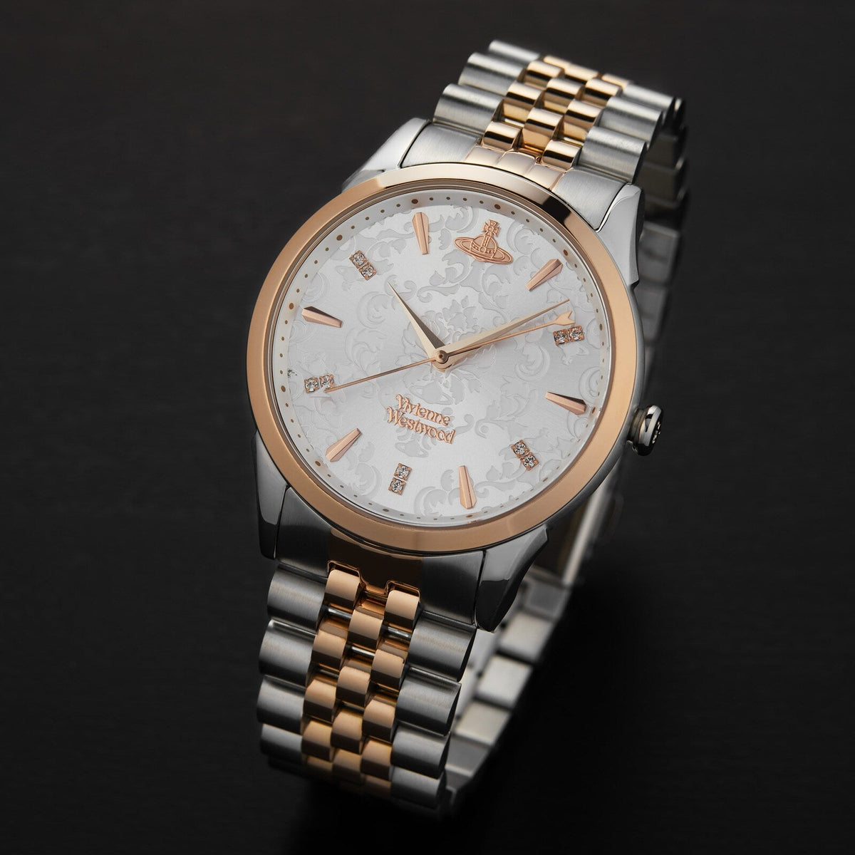 Vivienne Westwood Wallace women's watch with a silver dial and two tone stainless steel bracelet. Shown at an angle.
