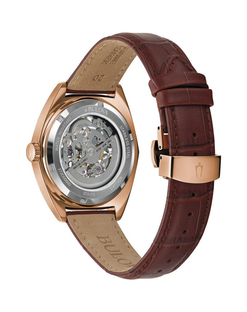 Luxury wristwatch with a rose gold case and brown leather strap.