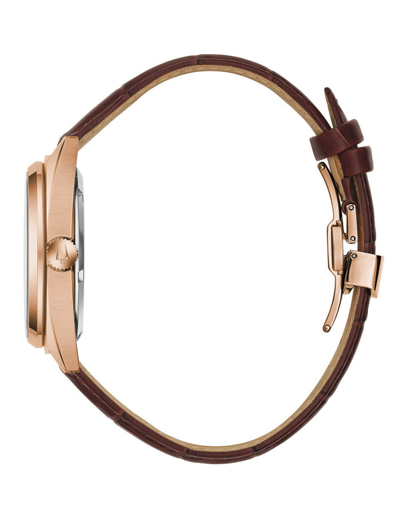 Wristwatch with a brown leather strap and rose gold-toned case.