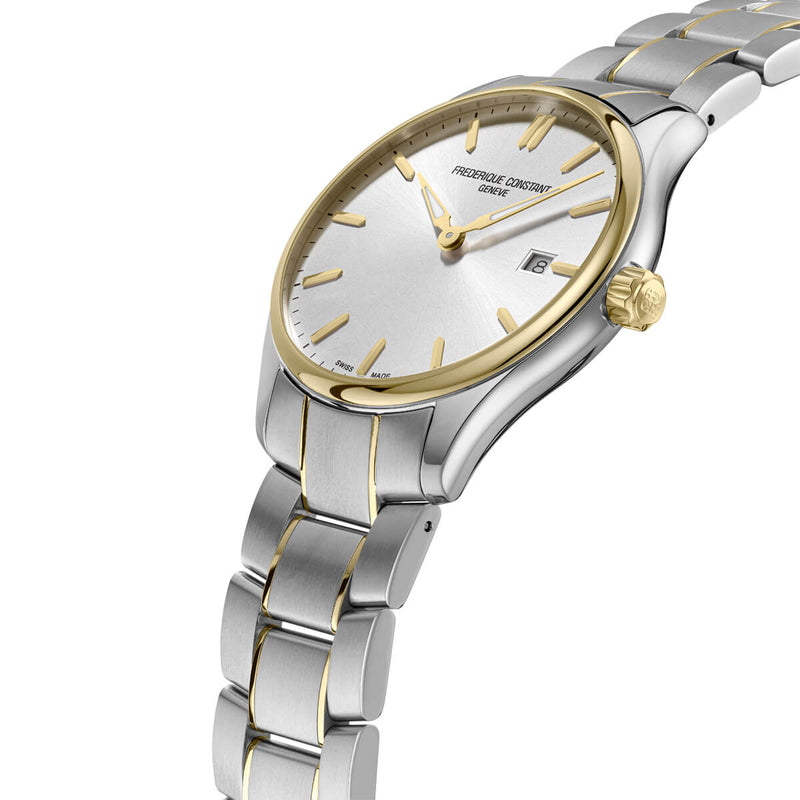 Elegant wristwatch with a two-tone silver and gold metal bracelet and round face.