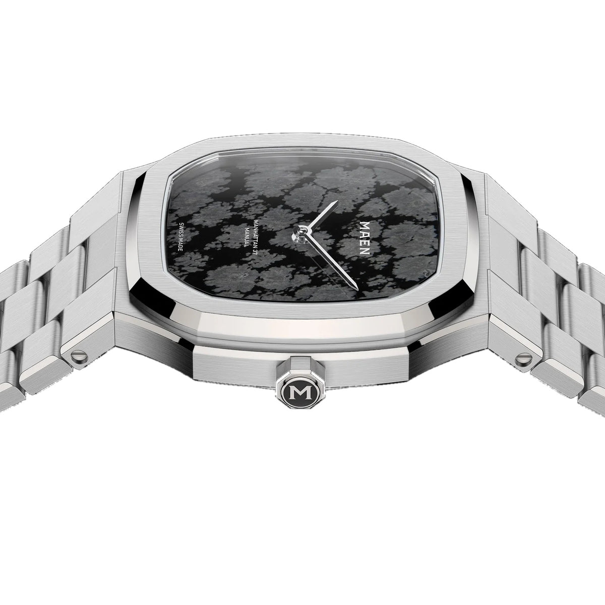 Angled close view of the MAEN Manhattan 37 Ultra Thin M2.2.7 showing the pale inclusions scattered across the dark obsidian dial