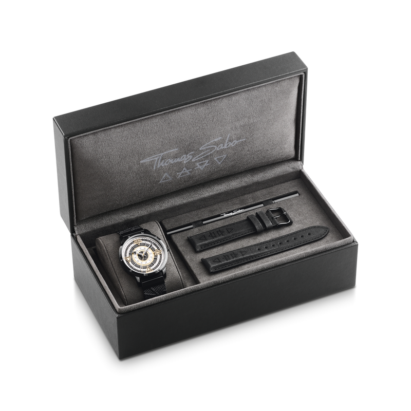 Luxury watch presented in an open black presentation box with additional compartments.