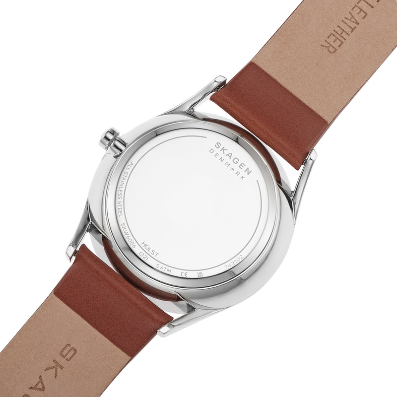 Back of a wristwatch with a brown leather strap.