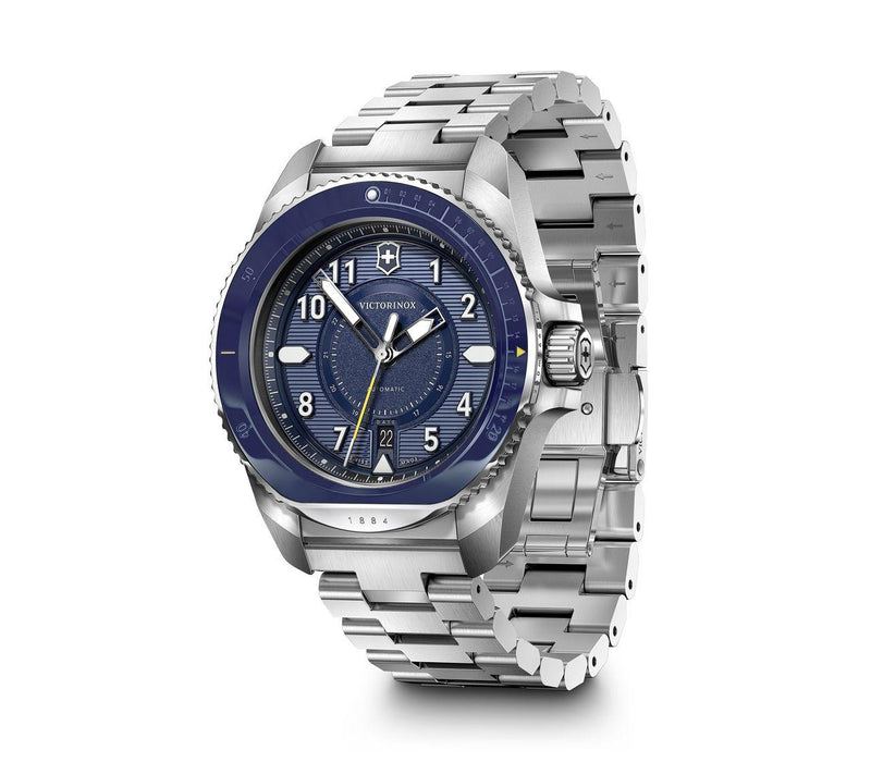 Stainless steel wristwatch with a blue bezel and silver metal bracelet.