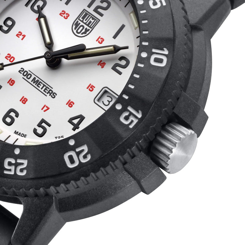 Wristwatch with a white dial, black bezel, and prominent hour markers.