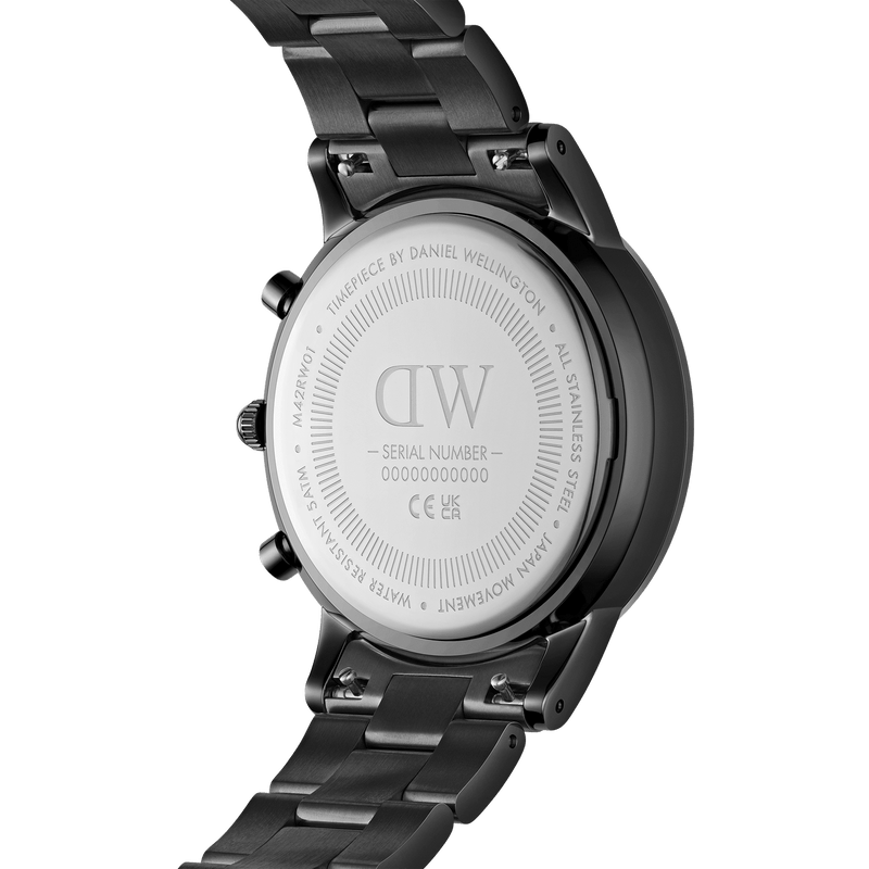 Back of a black metal wristwatch with ’DW’ engraved on its casing.