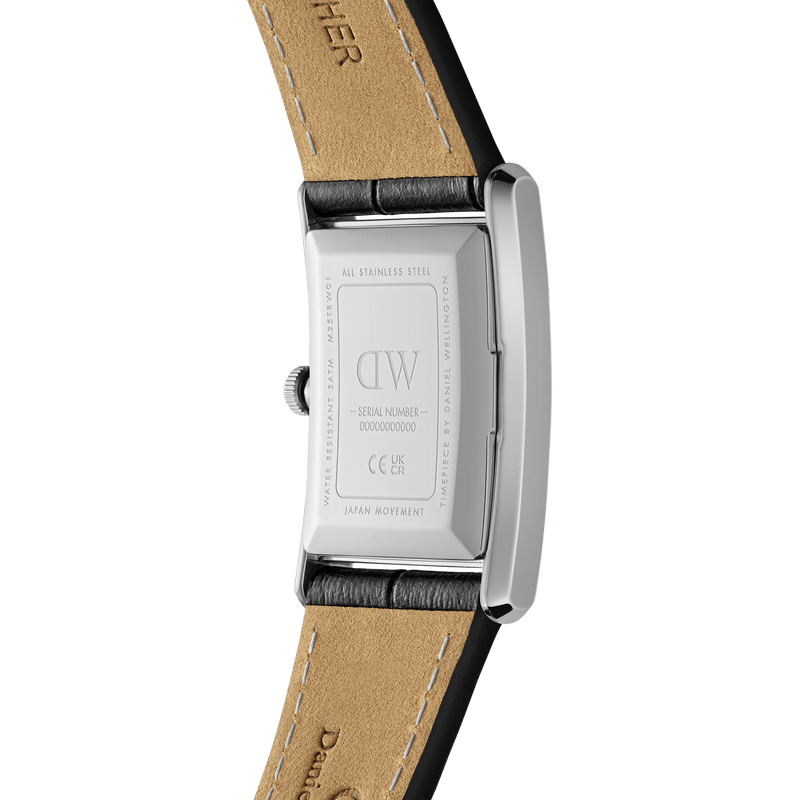 Back of a rectangular wristwatch with a leather strap.