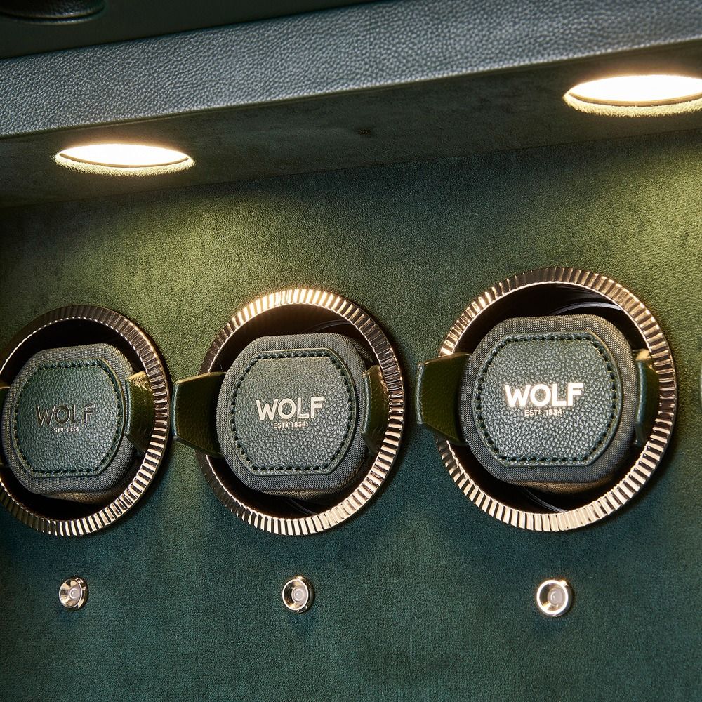 WOLF Athos 12 Piece Watch Winder Safe in Green, close-up of the lit watch winder modules