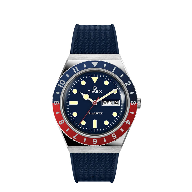 Timex wristwatch with a blue and red bezel and navy blue strap.