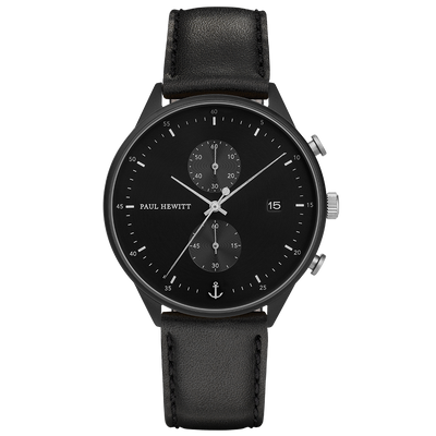 Black wristwatch with a leather strap and chronograph subdials on the face.