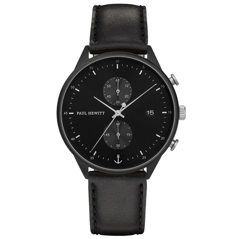 Black wristwatch with a leather strap and chronograph subdials on the face.