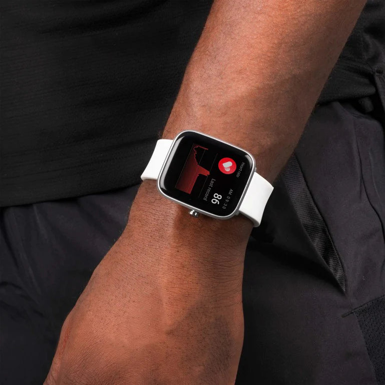 Smartwatch with a white band displaying a heart rate monitor on its screen.