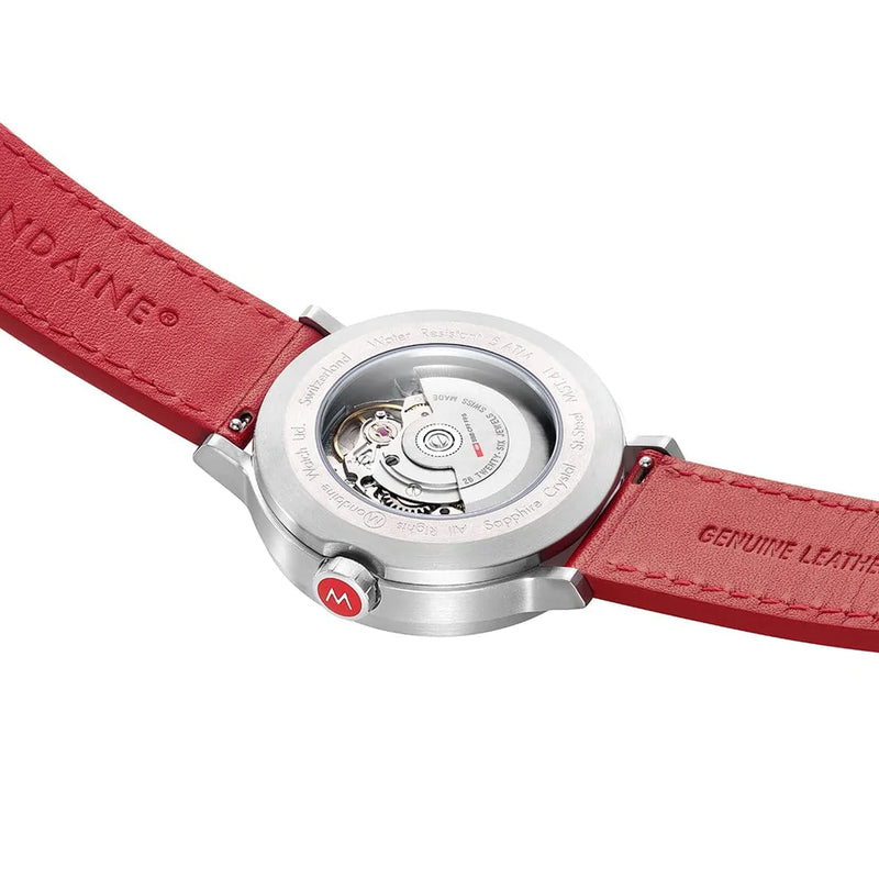 Wristwatch with a red leather strap and visible mechanical movement through the case back.