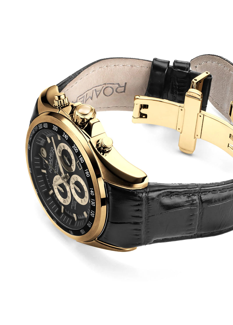 Luxury gold-toned wristwatch with a black leather strap and chronograph dial.