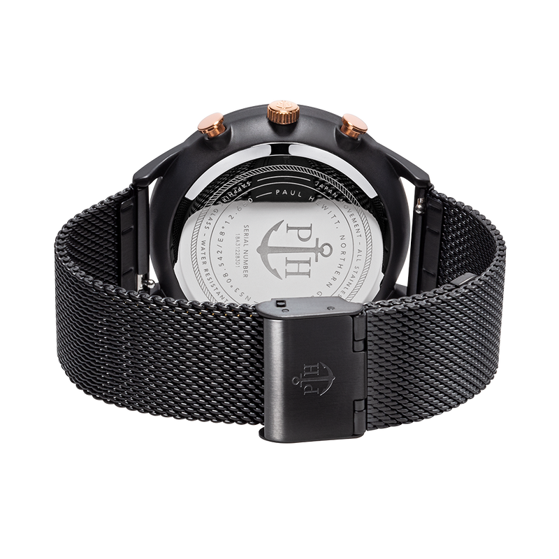 Black wristwatch with a mesh metal band and rose gold accents.