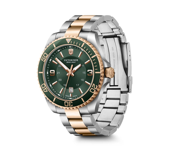 Luxury wristwatch with a green dial and two-tone metal bracelet.