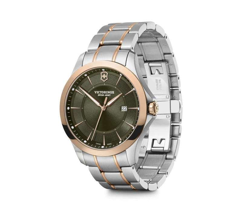 Elegant wristwatch with a two-tone metal band and green dial face.