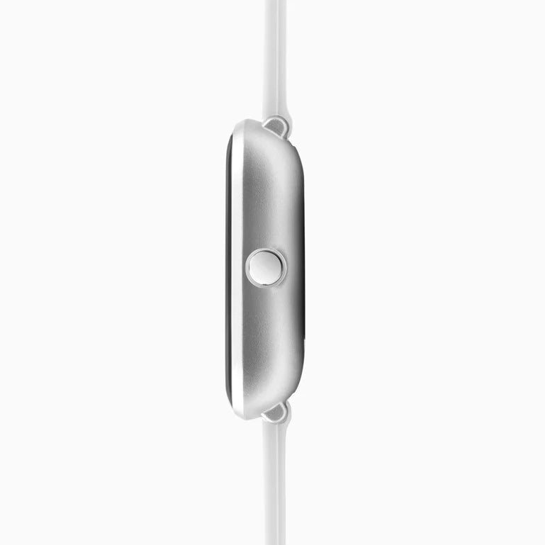 Sleek, silver wireless earbud with a circular button on its side.