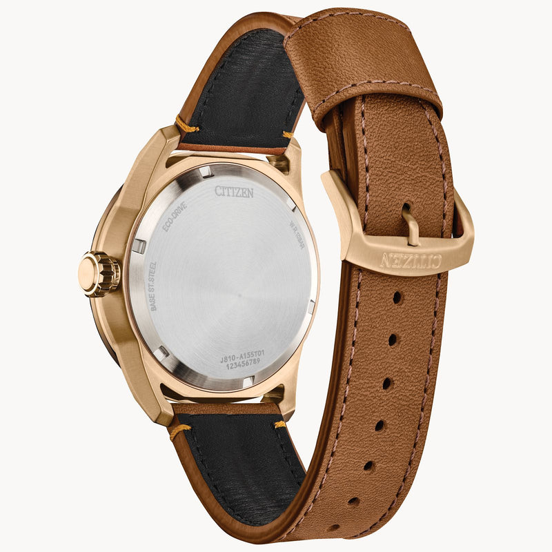 Gold-toned wristwatch with a brown leather strap.