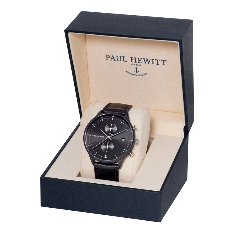 Elegant black wristwatch displayed in a Paul Hewitt presentation box.