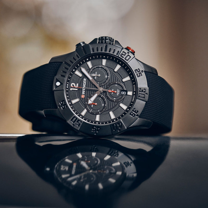 Sleek black sports watch with a chronograph dial and rotating bezel.