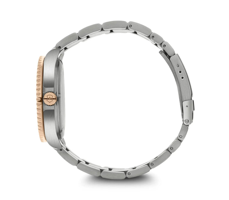 Stainless steel wristwatch with a rose gold-colored bezel.