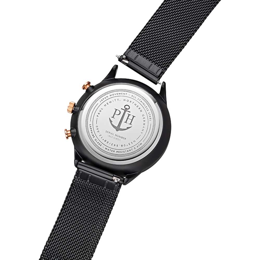 Back of a wristwatch with a black mesh strap and engraved metal case back.