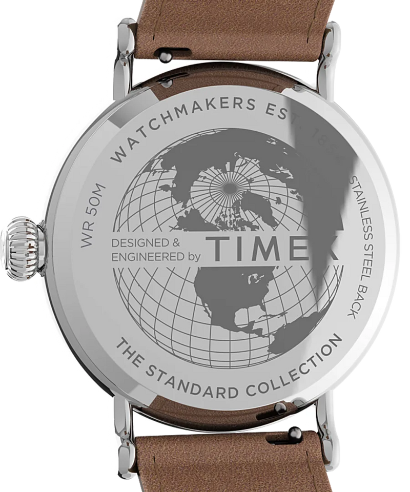 Back of a wristwatch with an engraved world map design and text.