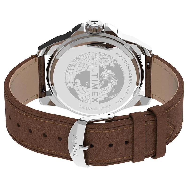 Wristwatch with a brown leather strap and silver case showing its engraved back.