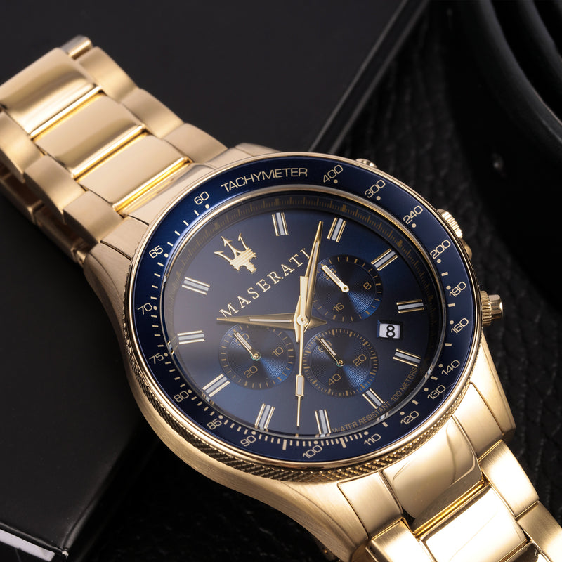 Gold-toned Maserati wristwatch with a blue dial and chronograph features.