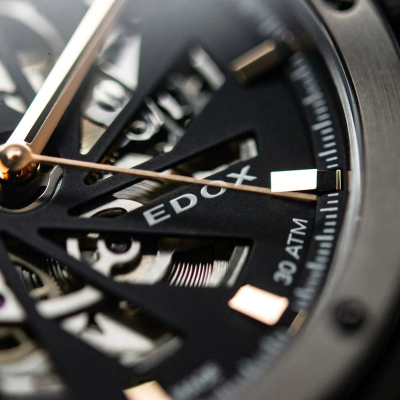 Close-up view of a luxury wristwatch face showing intricate mechanical details.