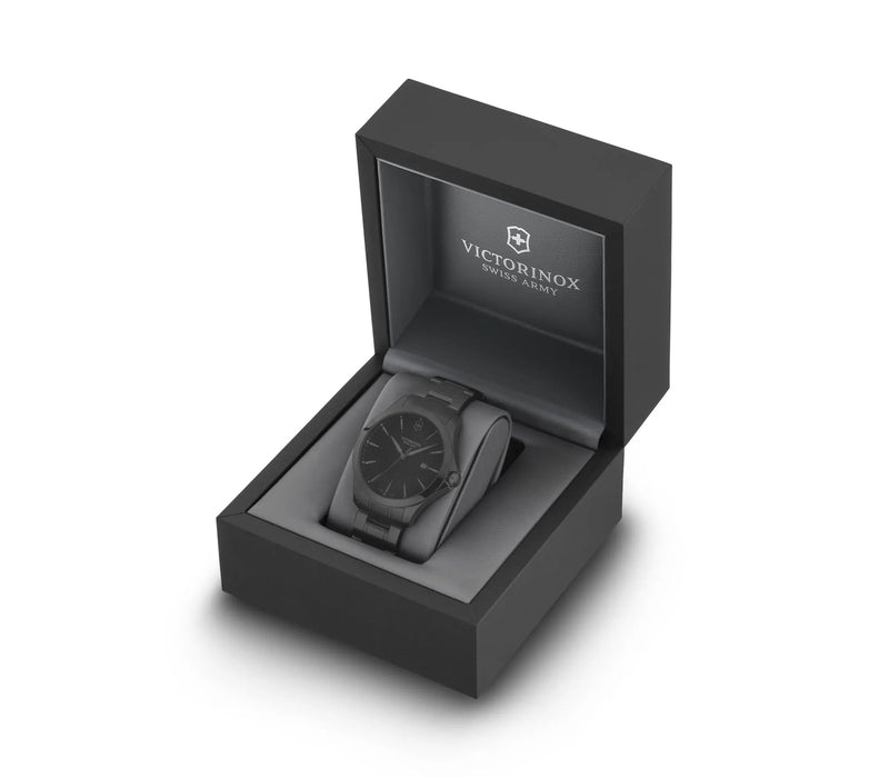 Wristwatch with a black face in an open presentation box.