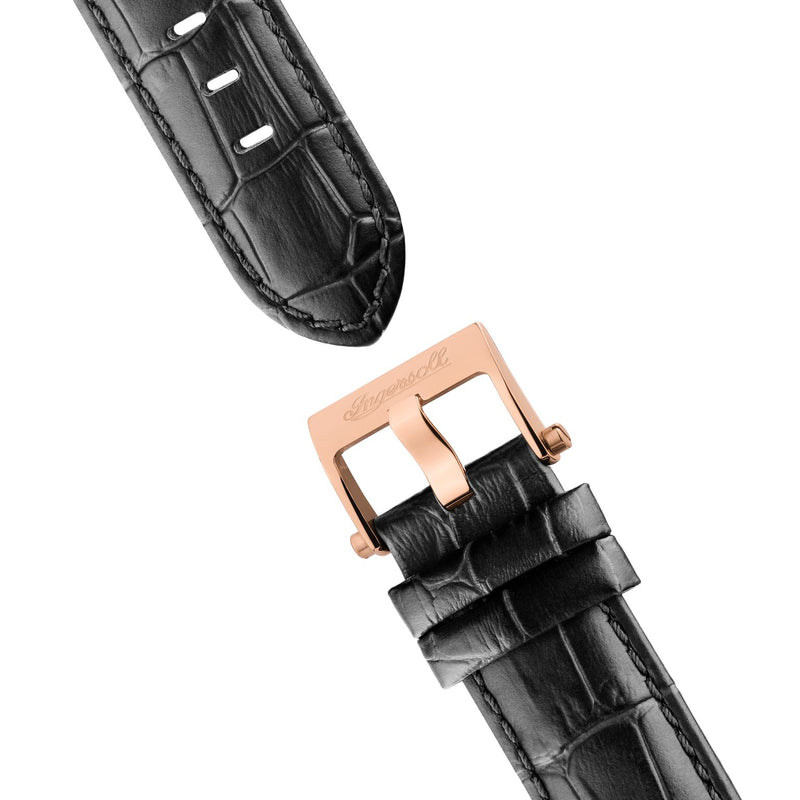 Black leather watch strap with a rose gold buckle.