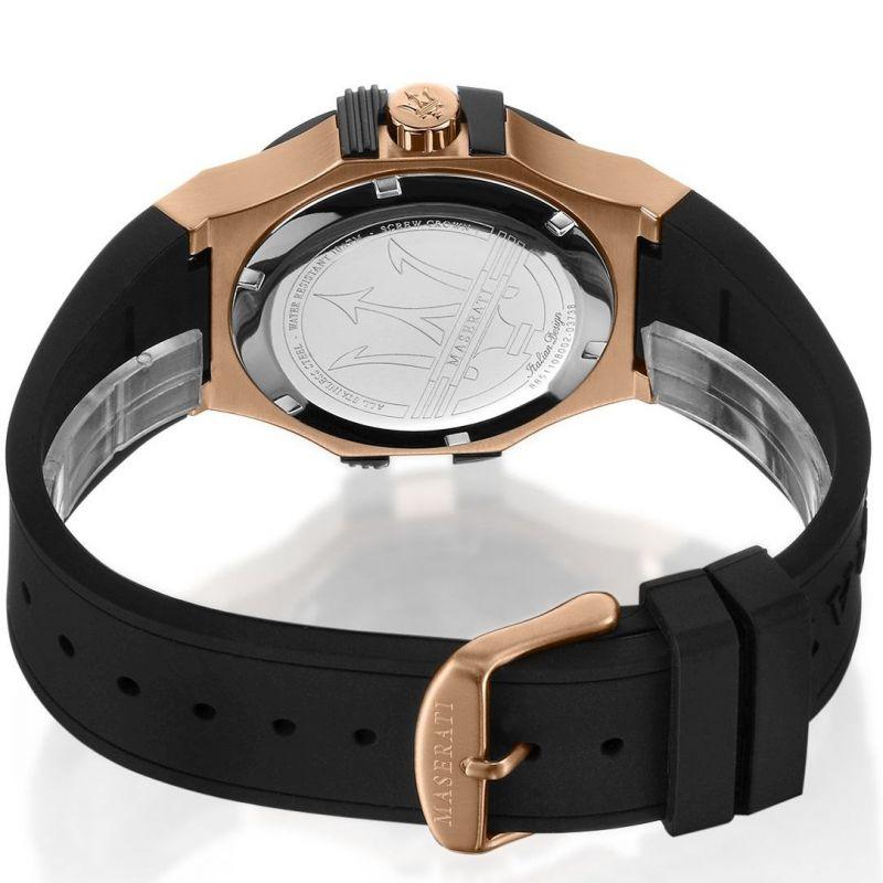 Luxury wristwatch with a rose gold case and black rubber strap.