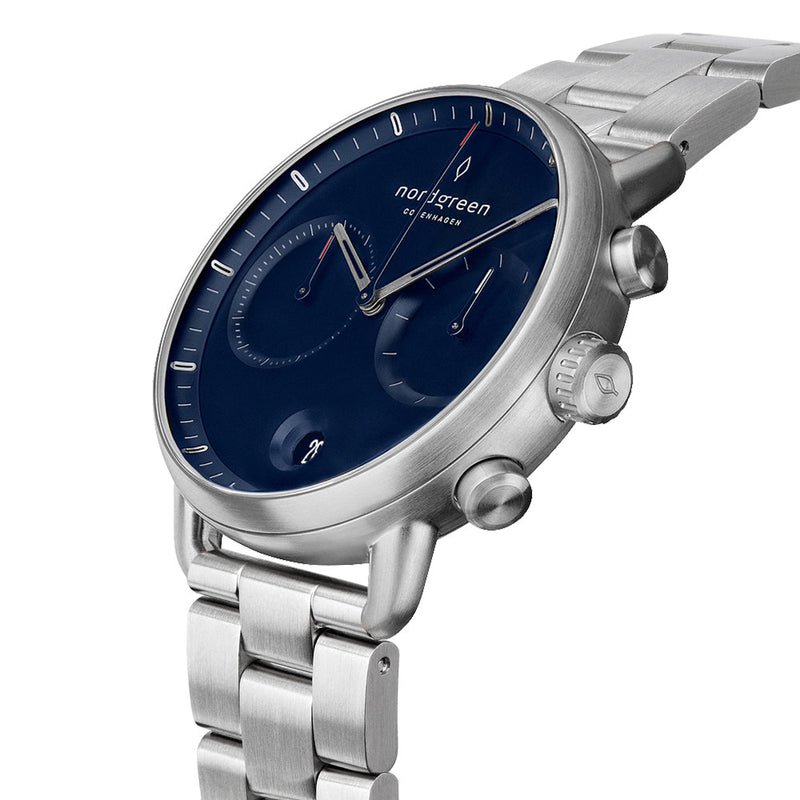 Sleek silver wristwatch with a dark blue dial and chronograph subdials.