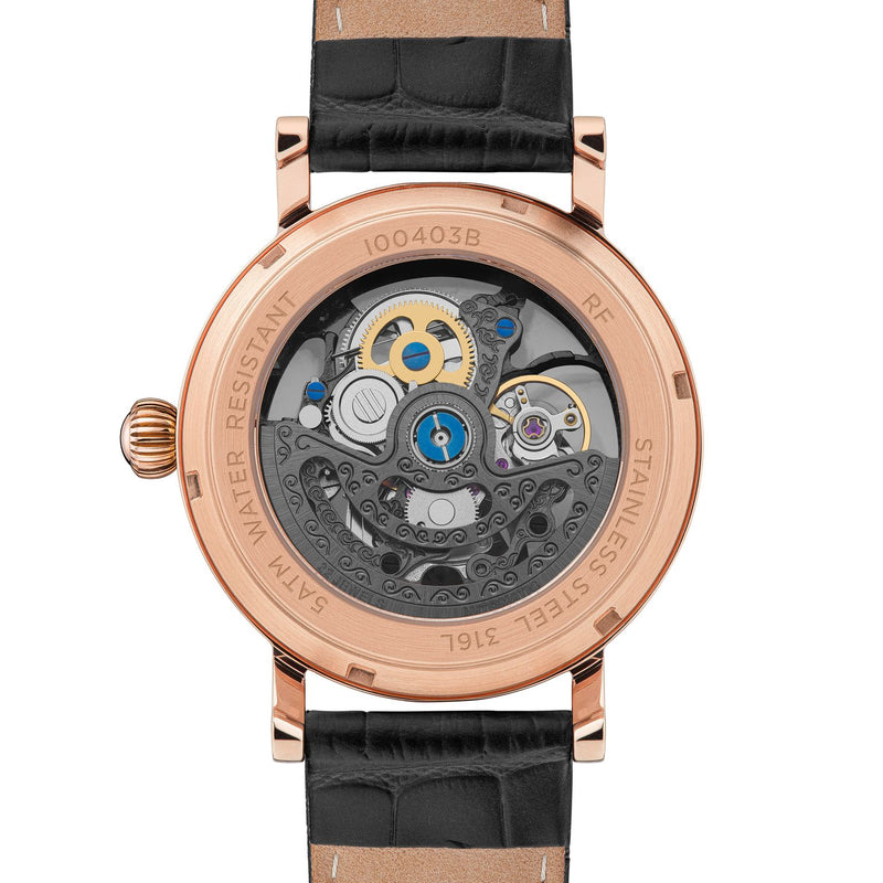 Luxury wristwatch with a visible mechanical movement through a transparent case back.