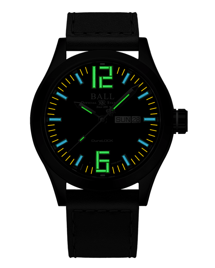 Black wristwatch with luminous dial displaying colorful numbers and markings.
