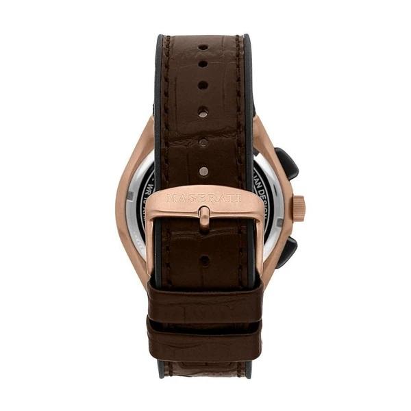 Wristwatch with a brown leather strap and rose gold-toned case.