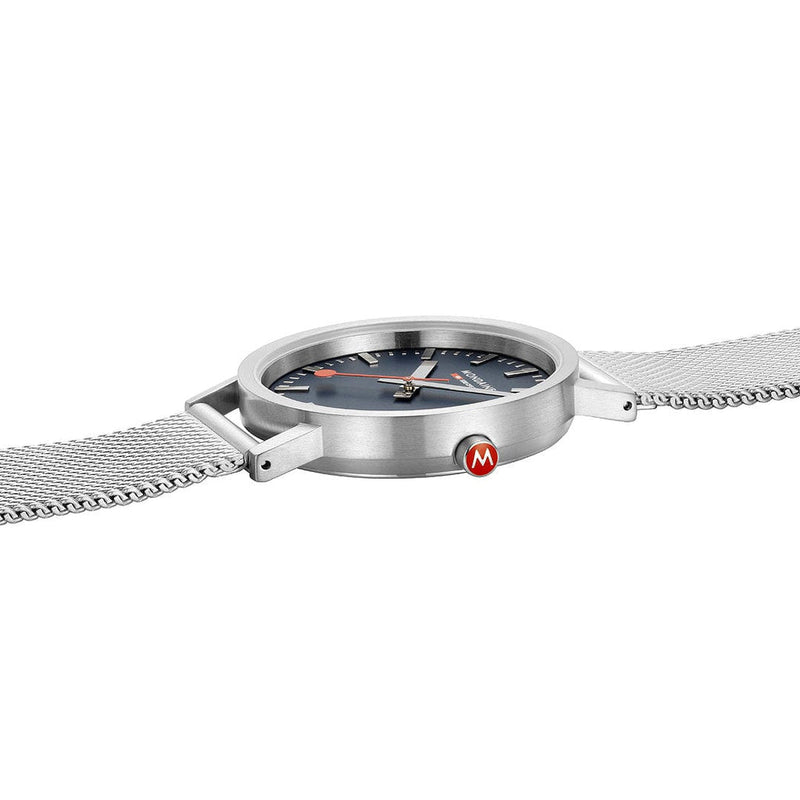Sleek silver wristwatch with a mesh metal band and a dark face.