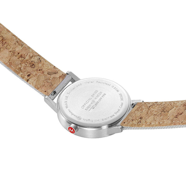 Wristwatch with a cork-textured leather strap and silver-toned case.