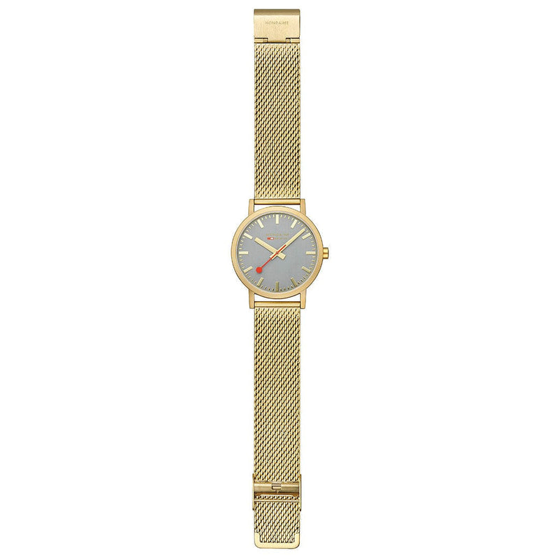 Gold-toned wristwatch with a mesh metal band and gray dial face.