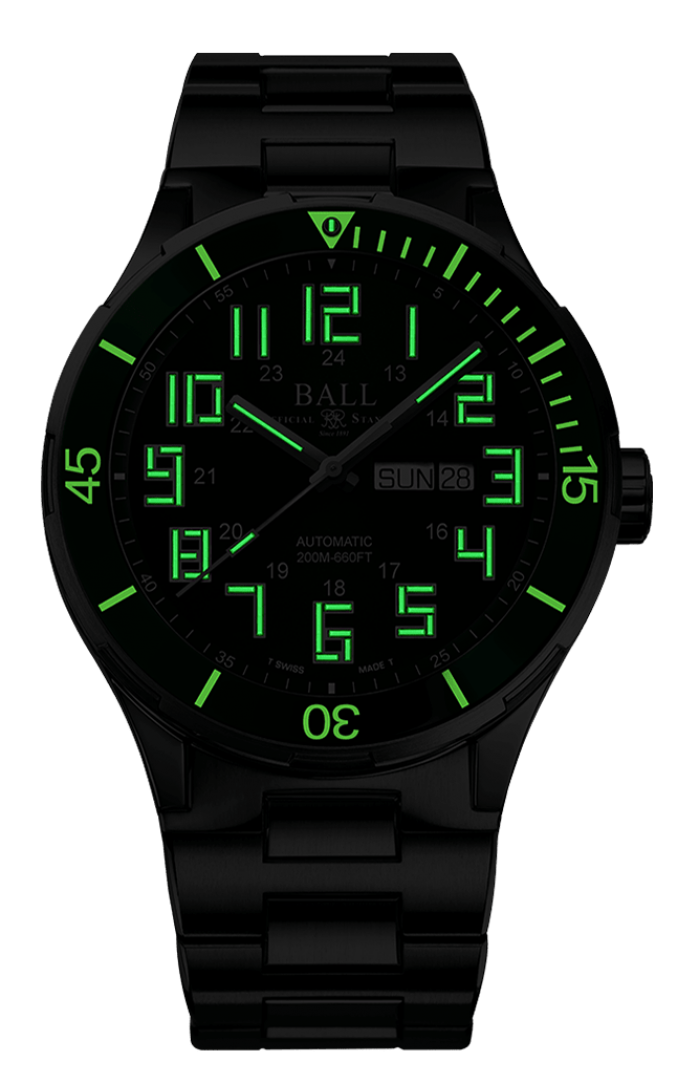 Black wristwatch with glowing green numerals and markings.